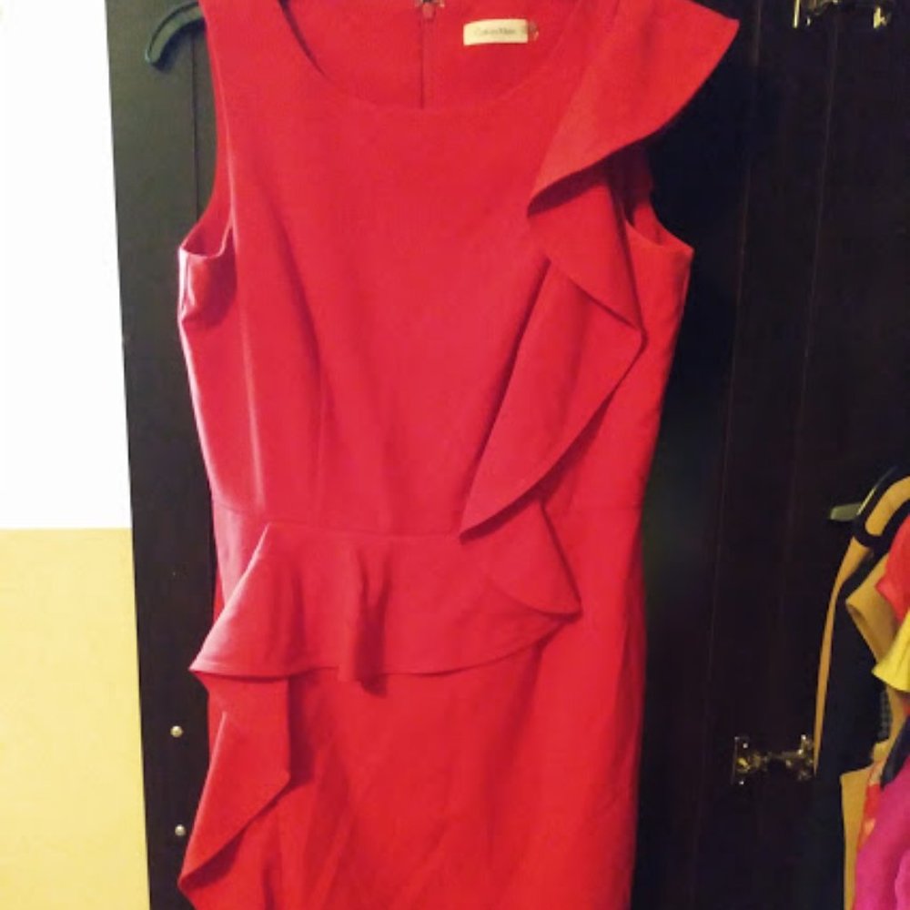 Calvin Klein knee length dress with ruffled rim.